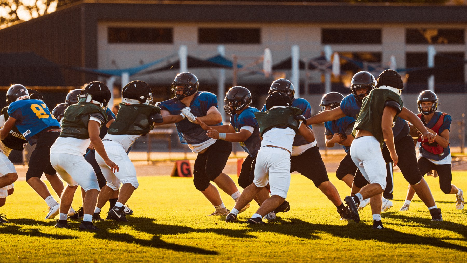 Arroyo Grande football working through a blocking drill