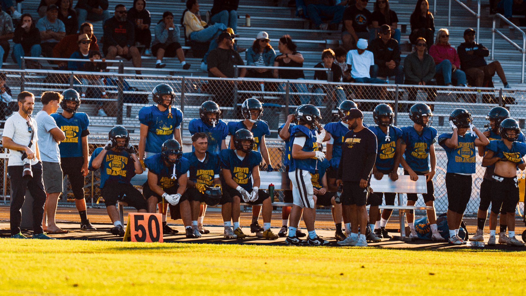 Arroyo Grande on the sideline at midfield during the scrimmage