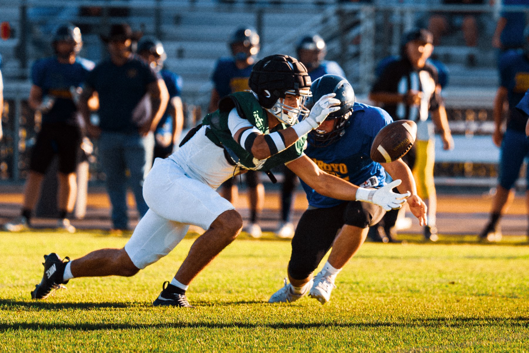 Arroyo Grande and Templeton players diving for a loose ball during the scrimmage