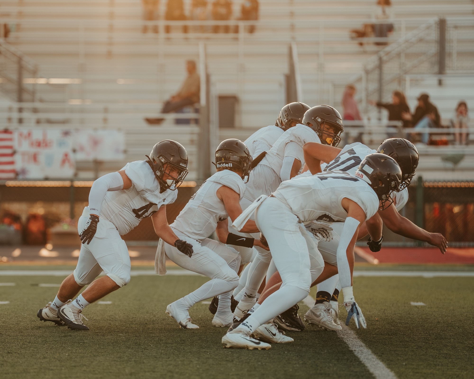 Arroyo Grande defensive line bursting off the line at the snap